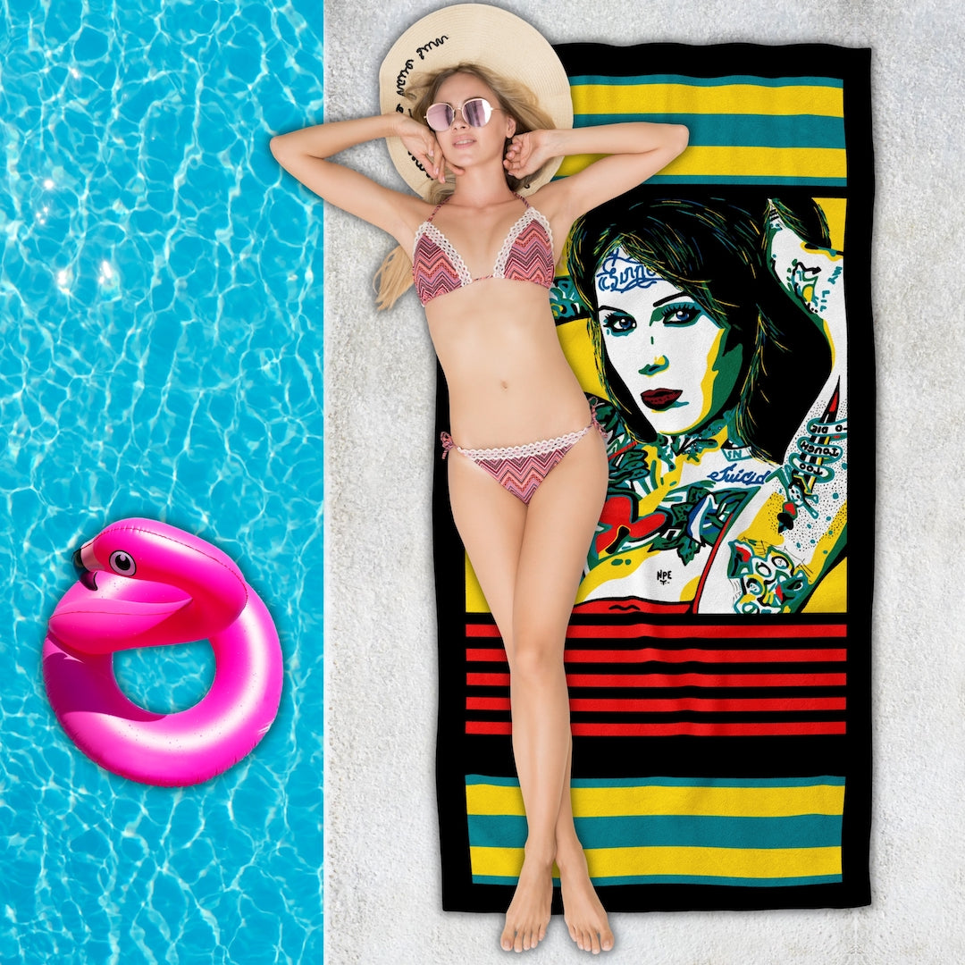 Woman lying poolside on an Erotic Pop Art Beach Towel | BOMBSHELL Design by Anita Nevar &amp; Ravenged.